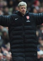 arsene-wenger-long-black-puffer-coat.jpg
