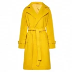 elisabeth-sparkle-the-substance-yellow-coat.webp